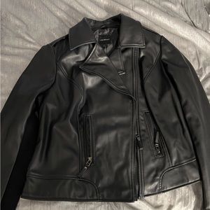 Pleather (polyester) biker jacket. Never worn. Perfect condition!
